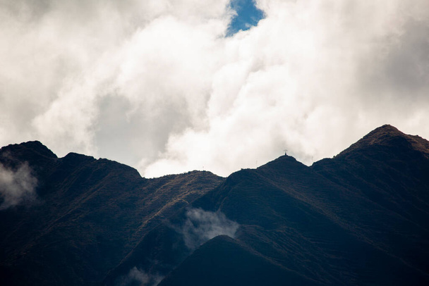 Image of a mountain in the Peruvian Andes. High mountain in Cusco, Peru. Andes in the afternoon with cloudy sky. - 写真・画像