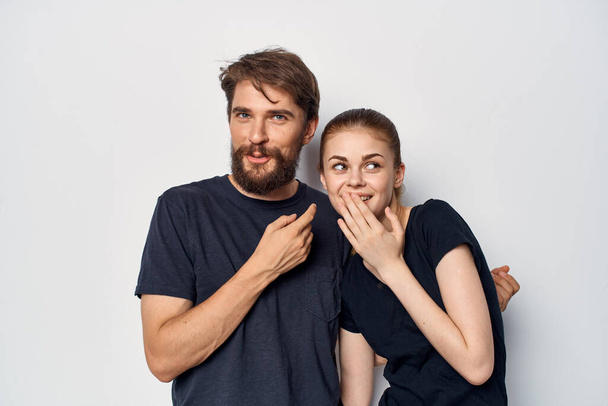 fashionable man and woman in black t-shirt sunglasses posing isolated background - 写真・画像