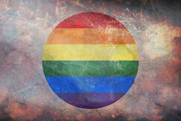 Top view of retro flag of LGBT Pride, Japan with grunge texture, no flagpole. Plane design, layout. Flag background. Freedom and love concept. Pride month, activism, community and freedom - 写真・画像