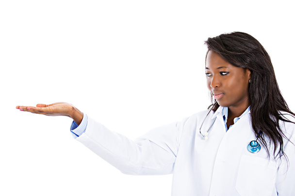 Female health care professional pointing at copy space - Фото, изображение