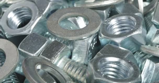 A group of bolts, nuts and washers close up. Fasteners. - Footage, Video