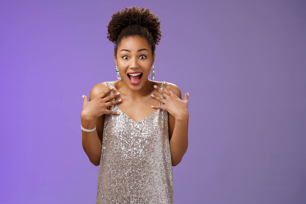 Amazed surprised attractive african-american young woman in glittering evening night dress scream happiness pointing herself amused cannot believe lucky win casino lottery, blue background - Foto, afbeelding