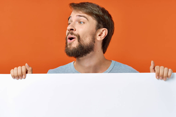 bearded man holding a white banner design isolated background - Photo, Image