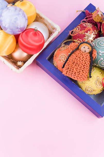 Multicolored Christmas decorative balls and figurines in a blue wooden box with sapce for text - Fotoğraf, Görsel