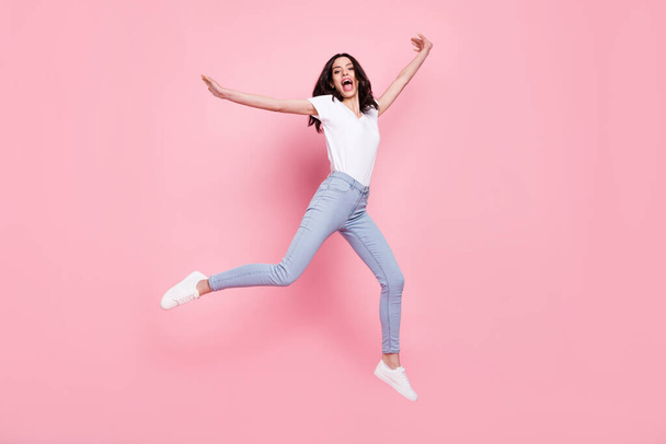 Full body photo of cheerful young crazy happy woman jump up enjoy sale isolated on pink color background - Фото, зображення