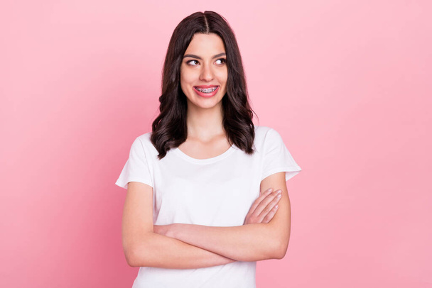 Photo of young dreamy happy confident woman look empty space hold hands crossed isolated on pink color background - Φωτογραφία, εικόνα