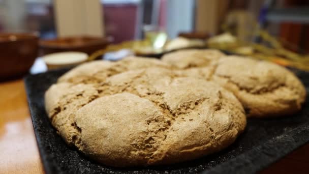 Homemade rye yeast-free bread. Two loaves of bread on a baking sheet. lose-up. Panning. - Footage, Video
