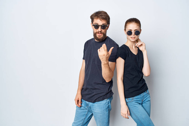fashionable man and woman friendship communication romance wearing sunglasses studio lifestyle - Foto, immagini