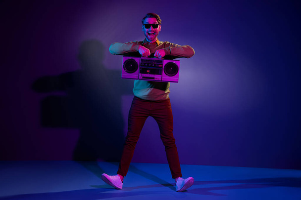 Full length body size photo guy in sunglass showing boom box dancing in night club isolated dark violet color background - Foto, Imagem