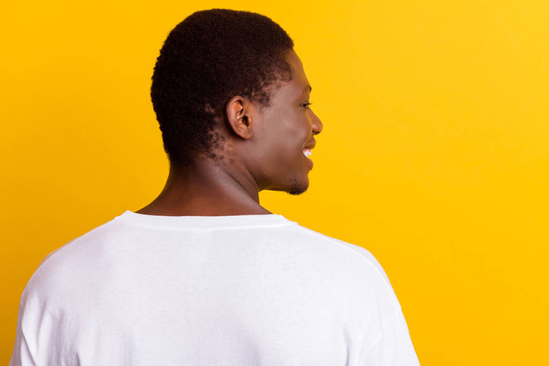 Profile photo of smile brunet millennial guy wear white t-shirt isolated on yellow color background - Valokuva, kuva