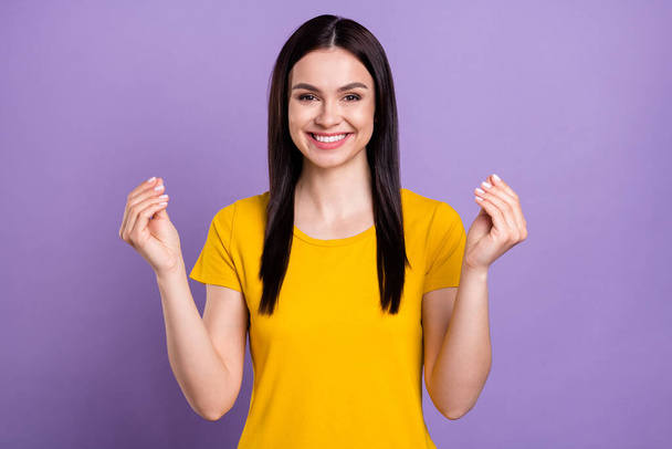 Photo of charming sweet young lady dressed yellow clothes showing gourmet gesture isolated purple color background - 写真・画像