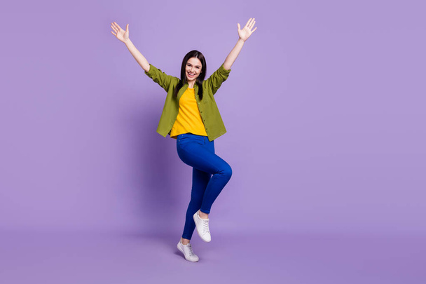 Full length photo of young cheerful girl happy positive smile have fun hands up isolated over purple color background - Valokuva, kuva
