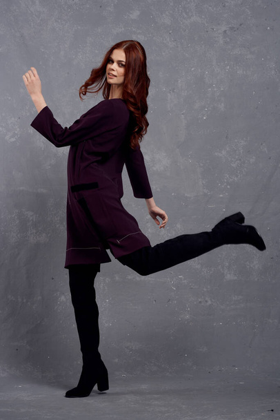 woman in fashionable clothes in full length posing in studio glamor - Фото, зображення