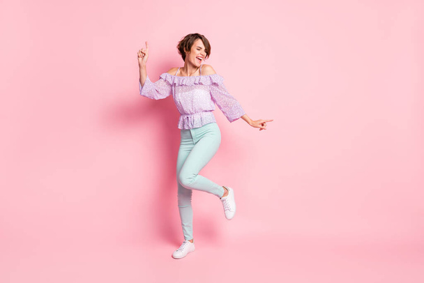 Full size photo of young attractive lovely happy excited girl dancing enjoying weekend isolated on pink color background - Foto, imagen