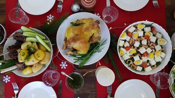 Christmas dinner with the family. turkey on the table. top view. the festive table is set - Фото, изображение