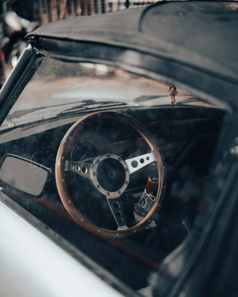An old car always catches the eye. It travels you to other times, where things had value. A silver convertible dazzling car catches your eye. - Fotó, kép