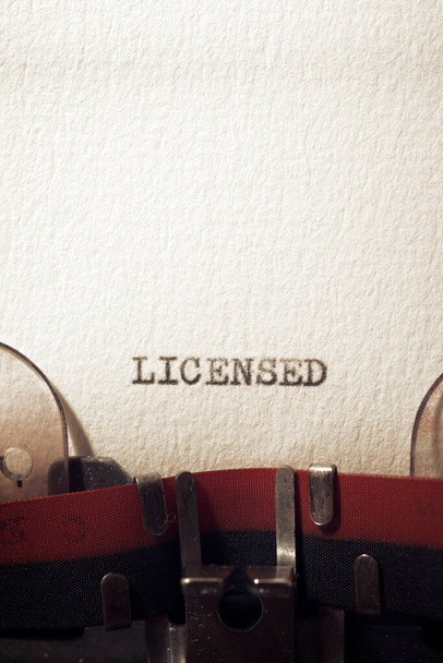 The word licensed written with a typewriter. - Photo, Image