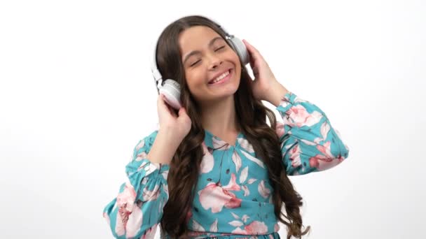 happy teen girl enjoying music listen her playlist in earphones and dancing, music fun - Footage, Video