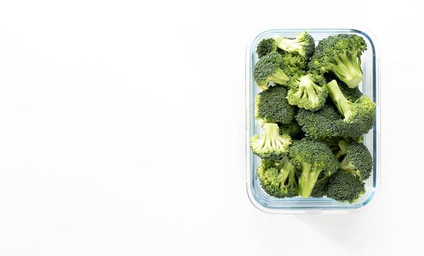 Washed And Sliced Broccoli Crown In Glass Container - Фото, изображение