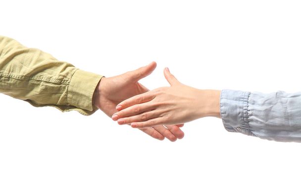 Woman and man shaking hands on white background - Foto, immagini