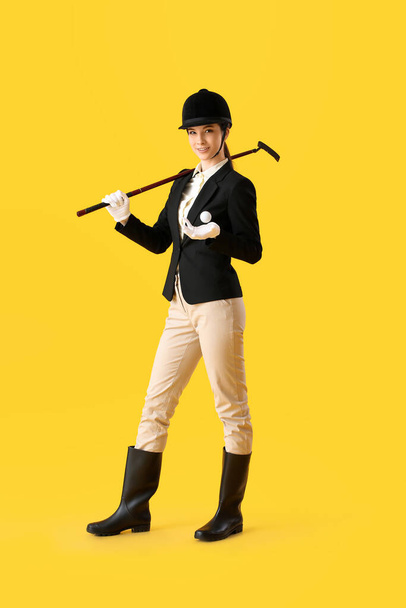 Beautiful female polo player on color background - Photo, Image