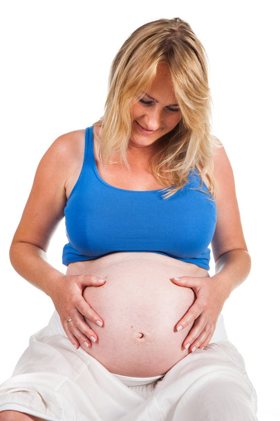 Pregnant blond woman - Foto, afbeelding