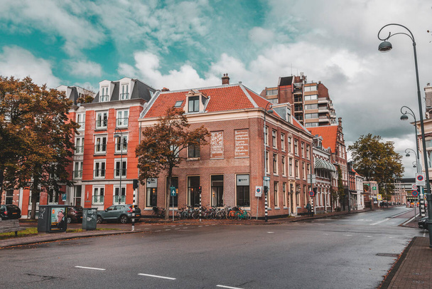 Haarlem, the Netherlands - October 13, 2021: Street view and generic architecture in Haarlem with typical Dutch style buildings. - Photo, image