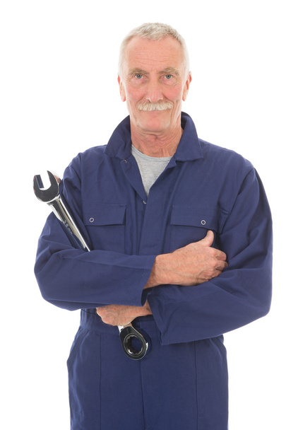 man in blue overall with wrench - Foto, Bild
