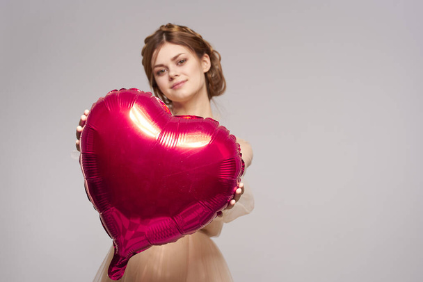 cheerful woman in a dress balloon Valentines Day model studio - Photo, image