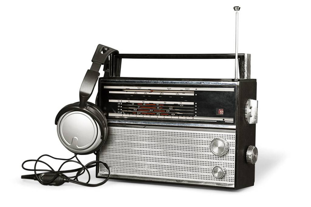 Black old retro portable radio and headphones - 写真・画像