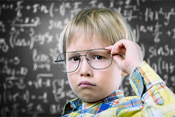 portrait of a little boy in glasses on  background - Фото, зображення