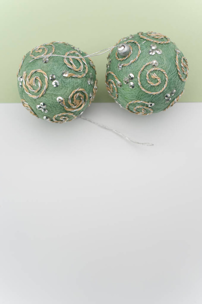 Green Christmas decorative balls with sapce for text on a white green  surface - Фото, зображення