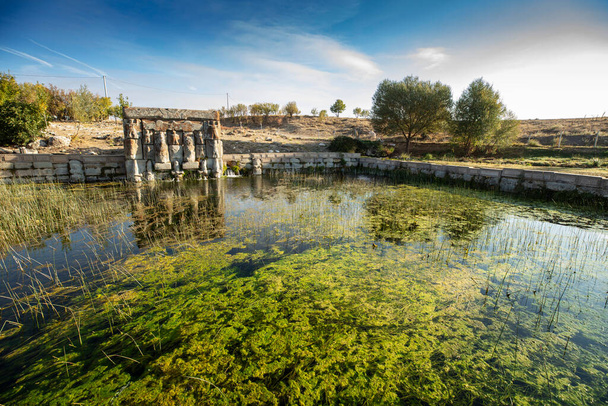 The Hittite spring sanctuary of Eflatun Pinar lies about 100 kilometres west of Konya close to the lake of Beysehir in a hilly, quite arid landscape. - Foto, Imagem