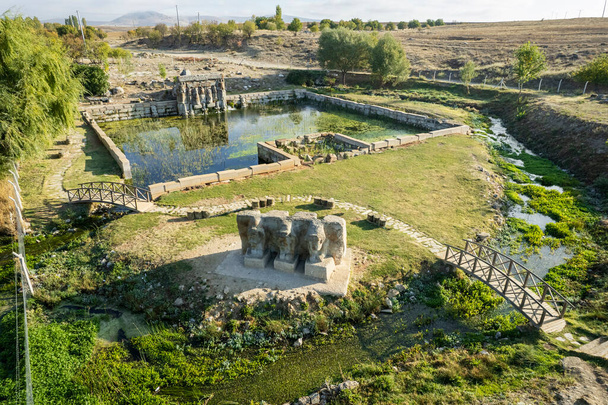 The Hittite spring sanctuary of Eflatun Pinar lies about 100 kilometres west of Konya close to the lake of Beysehir in a hilly, quite arid landscape. - Фото, изображение