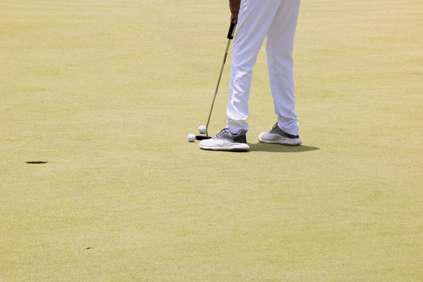 Close up of a young man training playing golf in Mexico - Photo, Image
