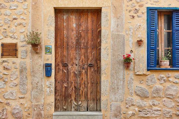 Picturesque traditional stone house facade and wooden window. Spain - Fotó, kép