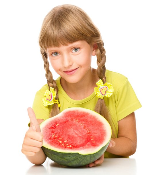 Little girl is eating watermelon - Fotoğraf, Görsel