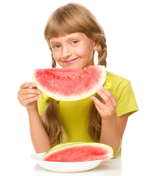 Little girl is eating watermelon - Fotó, kép