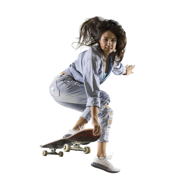 Skateboarder doing a jumping trick. Freestyle extreme sports concept isolated on white background - Valokuva, kuva