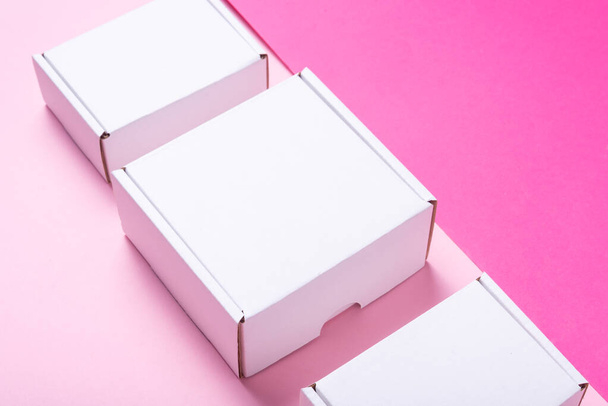 Set, lot of white cardboard box on color background, top view - 写真・画像