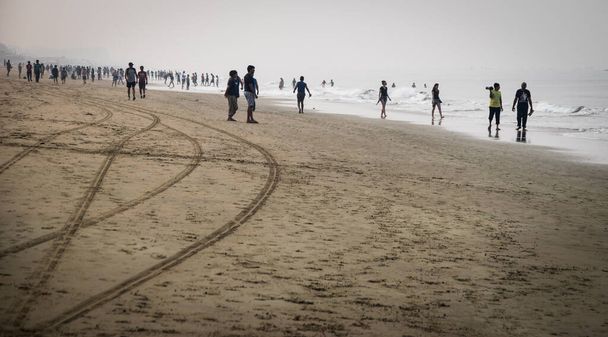 North Goa, India - January 16, 2017: Early foggy morning on the Baga beach. - Foto, immagini