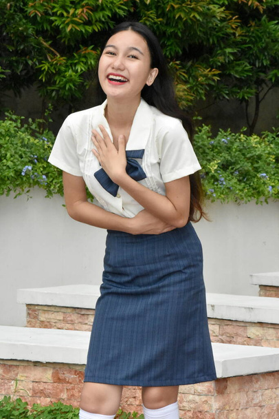 Cute Asian School Girl Laughing Wearing Uniform Standing - Fotografie, Obrázek