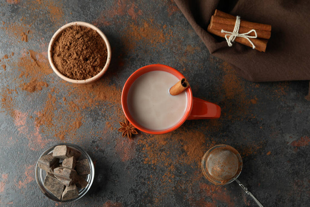 Concept of tasty drink with cocoa on dark background - Foto, imagen