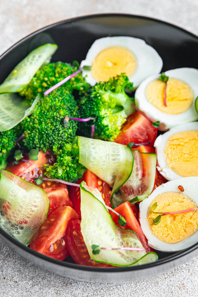 buddha bowl fresh salad boiled egg, broccoli, tomato, cucumber, vegetables meal snack on the table copy space food background rustic keto or paleo diet veggie vegan or vegetarian food no meat - Photo, image
