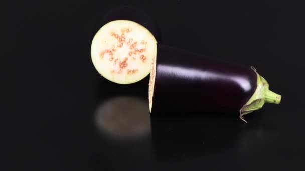 Eggplant on Black. Extrem close-up. Top view. Loop motion. Rotation 360. 4K UHD video footage 3840X2160. - Footage, Video