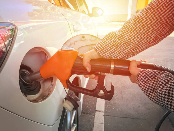 Woman refueling car  at the gas station background - Photo, Image