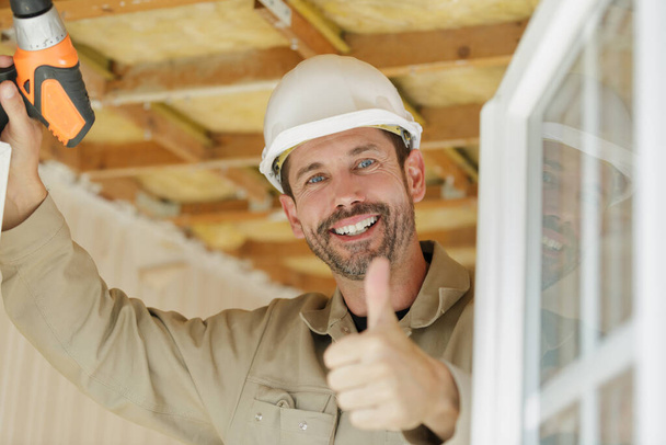 happy male builder showing thumb-up - Fotografie, Obrázek