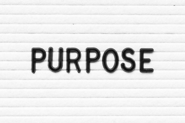 Black letter in word purpose on white felt board background - Photo, Image