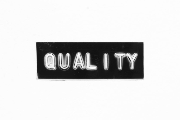 Banner de color negro que tiene letra en relieve con calidad de palabra sobre fondo de papel blanco - Foto, Imagen