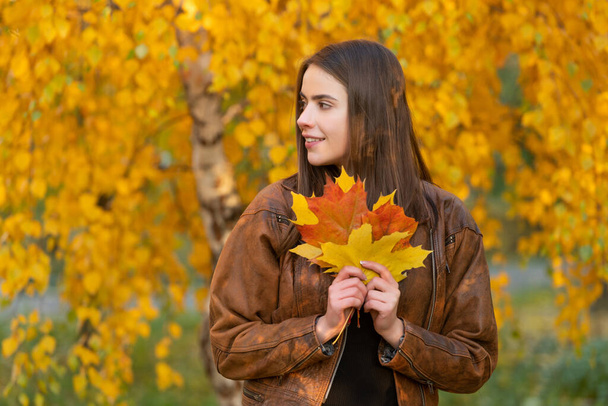 beautiful face portrait. natural beauty. fall season fashion. girl enjoy weather with autumn leaves. - Zdjęcie, obraz